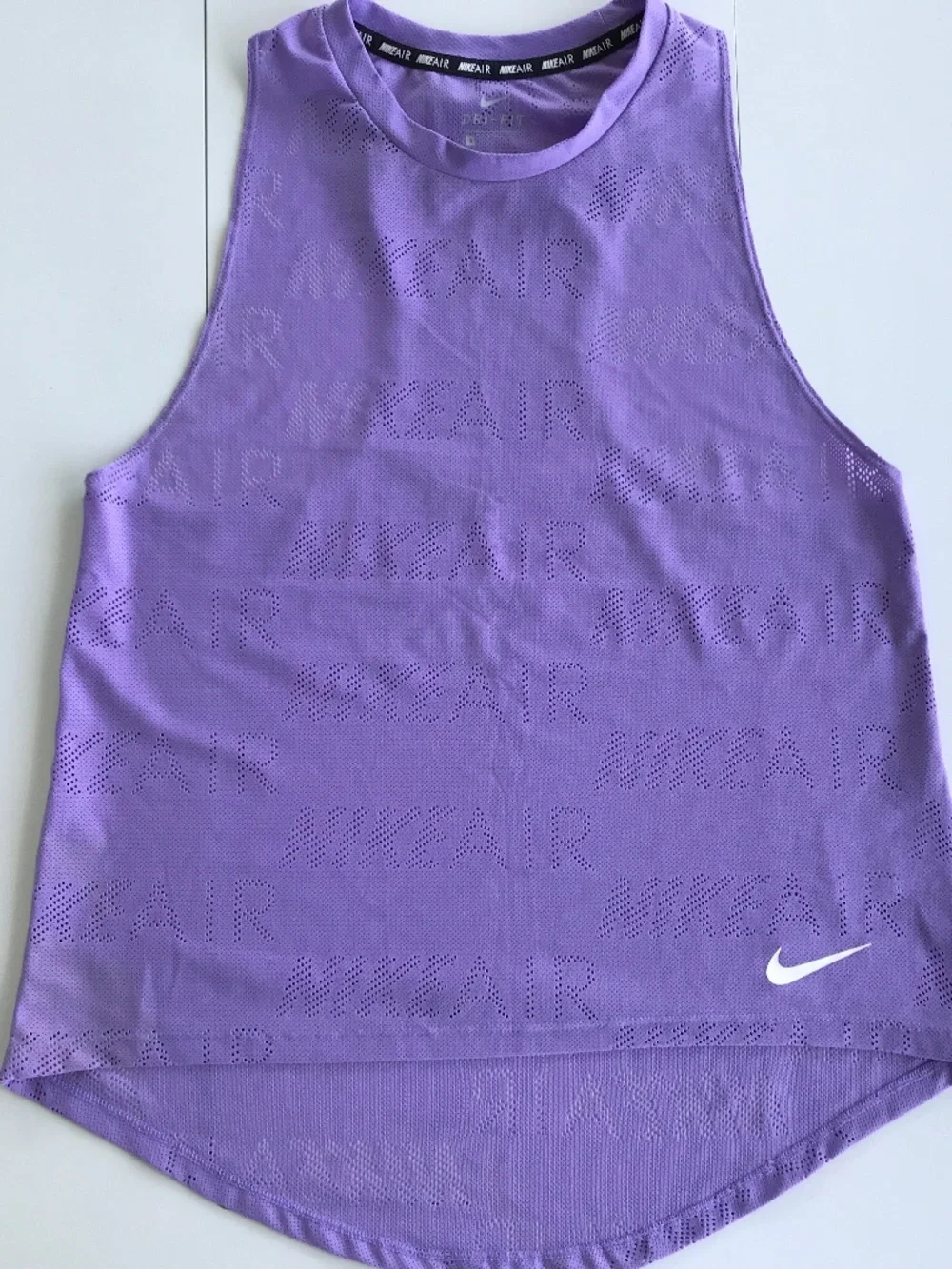 TWO Nike athletic tops. M, DRI Fit and laser cut patterns.